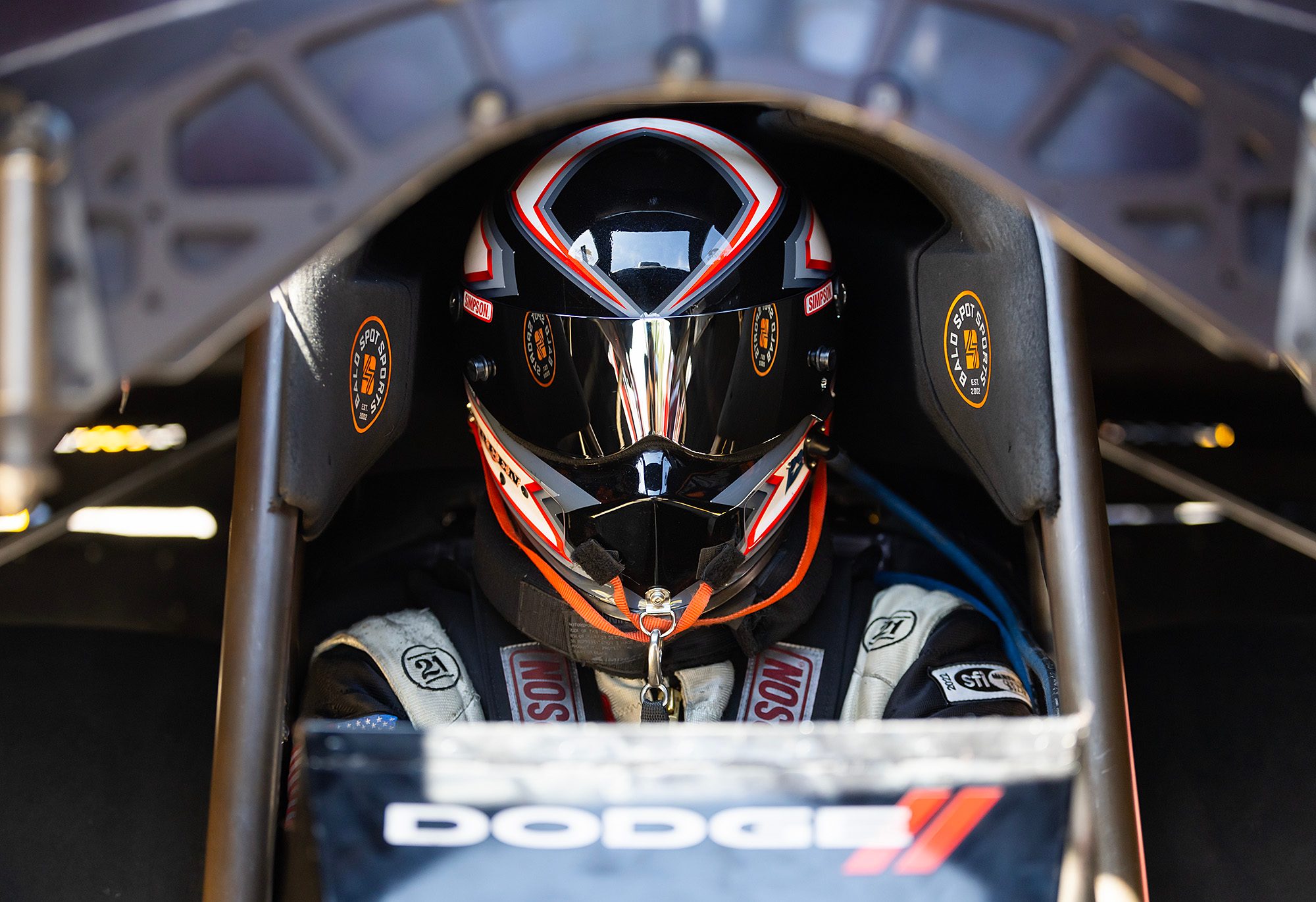 Strapped in and helmet on, waiting in the cockpit before a run