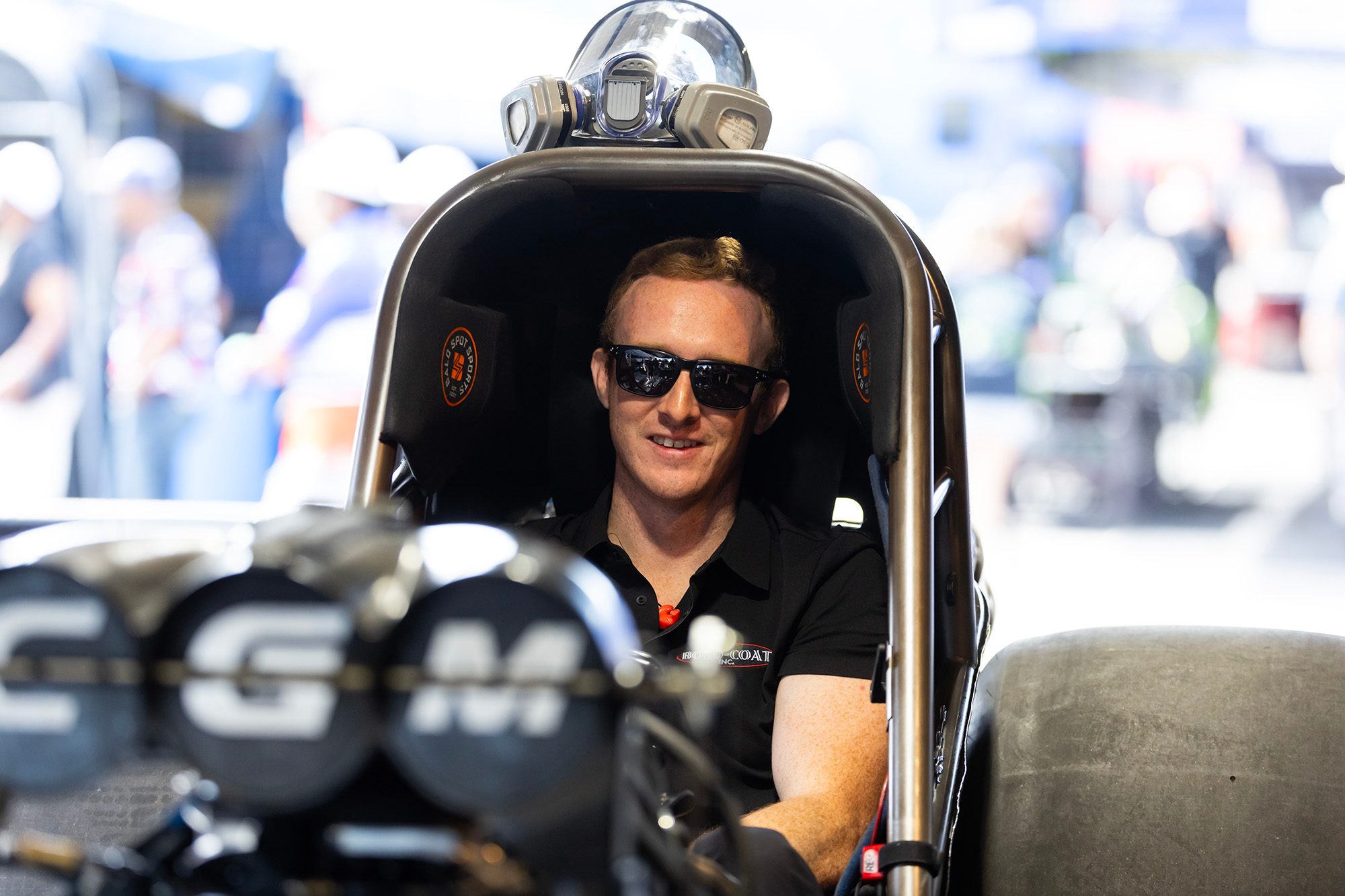 Hunter Green sits in the open chassis behind the CGM injector hat