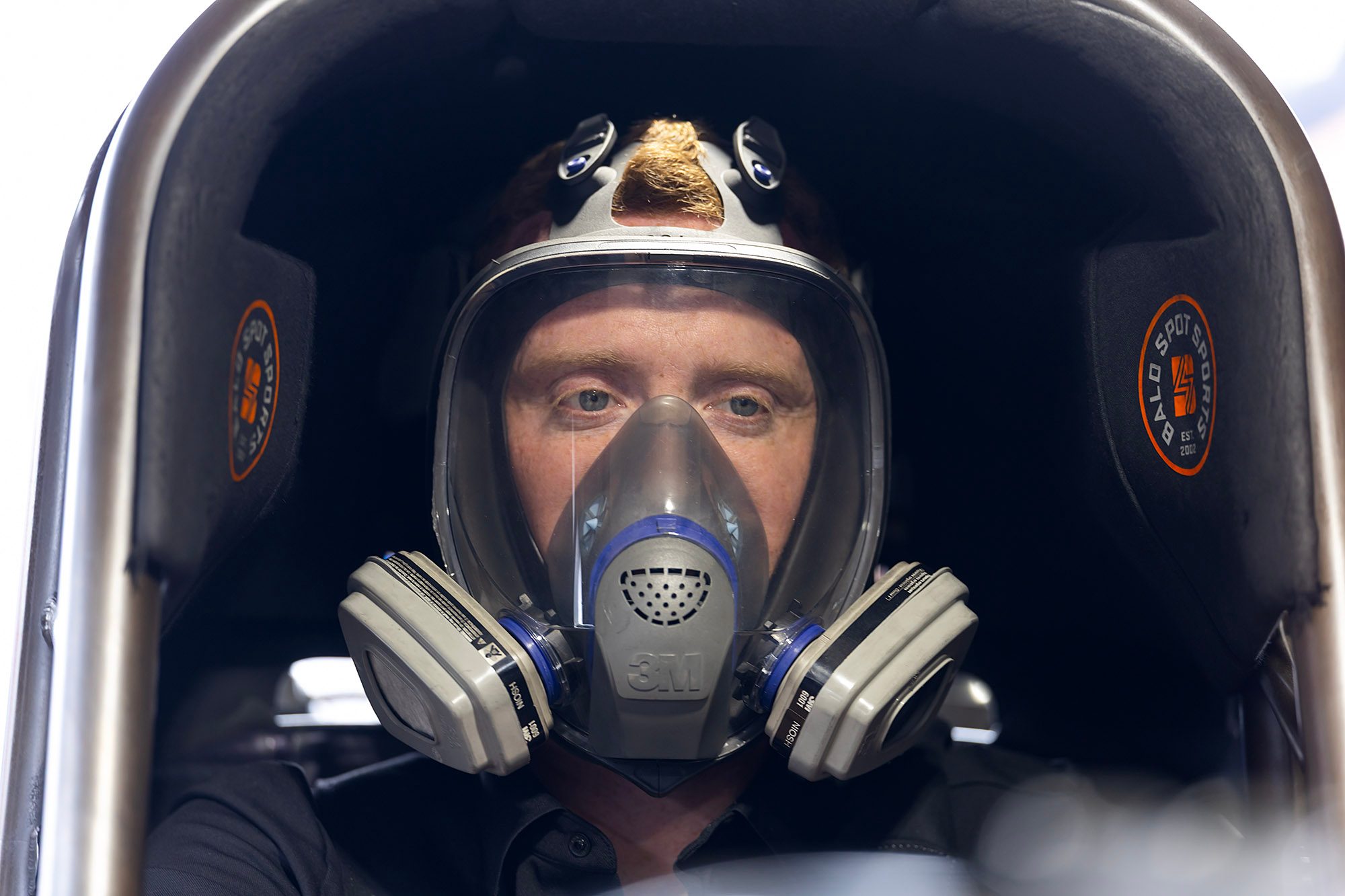 Masked up for the warm-up as the nitro engine fires
