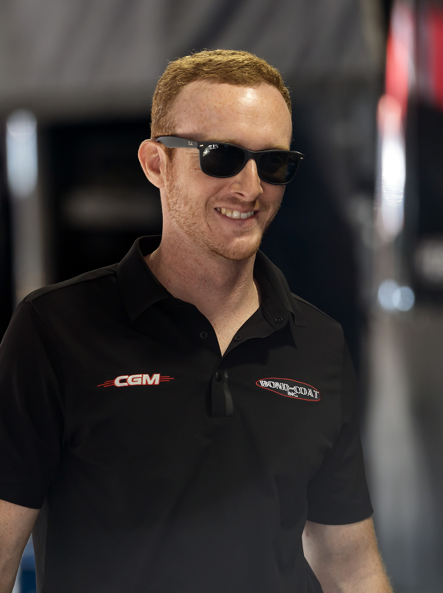 Hunter Green smiling in the CGM team polo