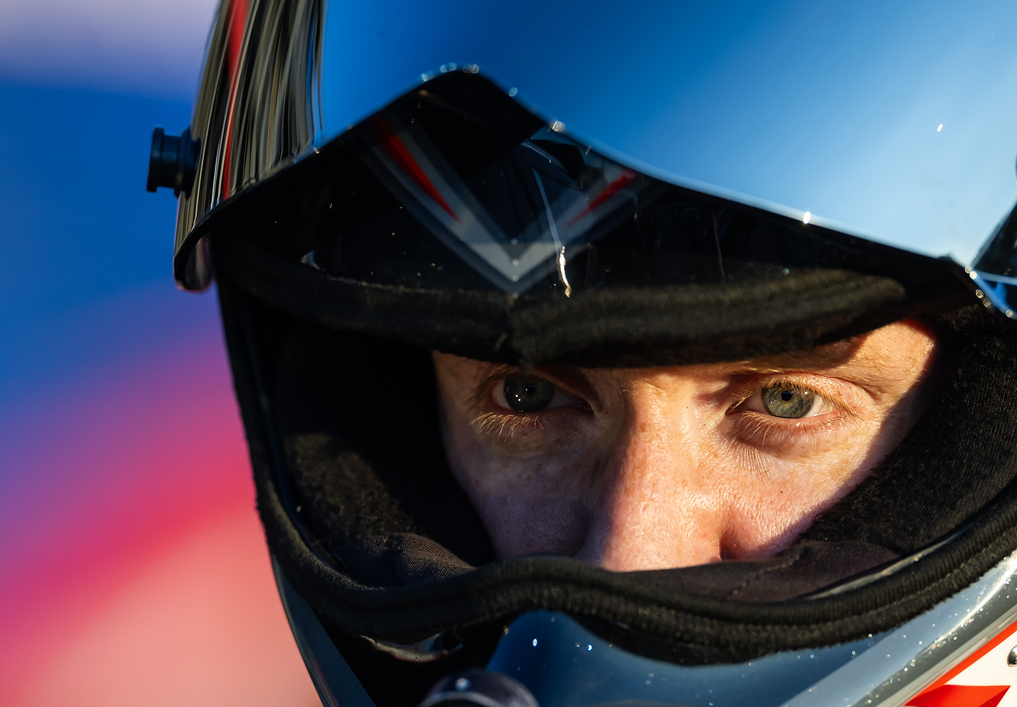 Hunter Green's eyes through the helmet visor at golden hour
