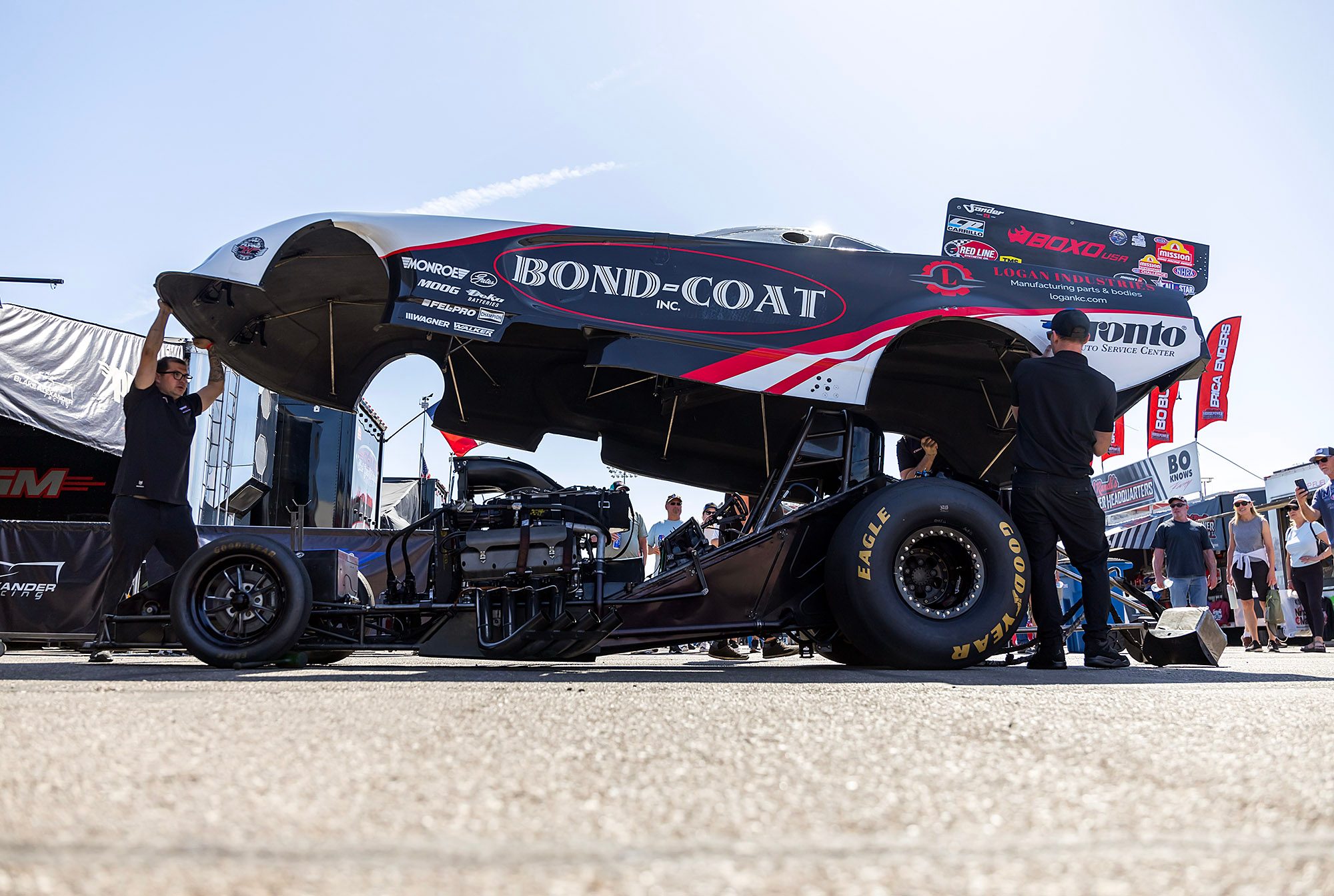 Body up: the Bond-Coat Funny Car's engine exposed in the pits