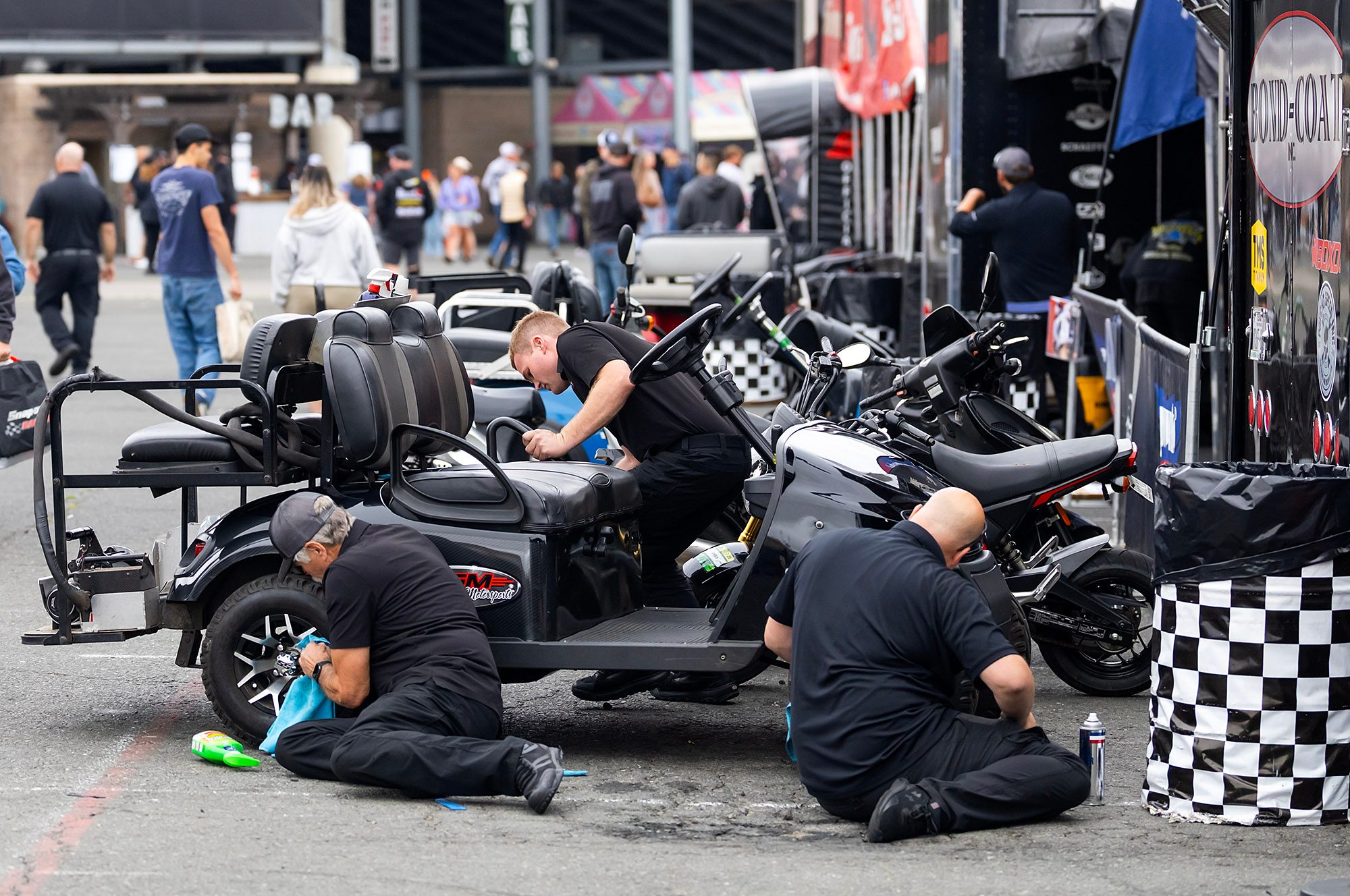 The crew preps the bare chassis in the pit