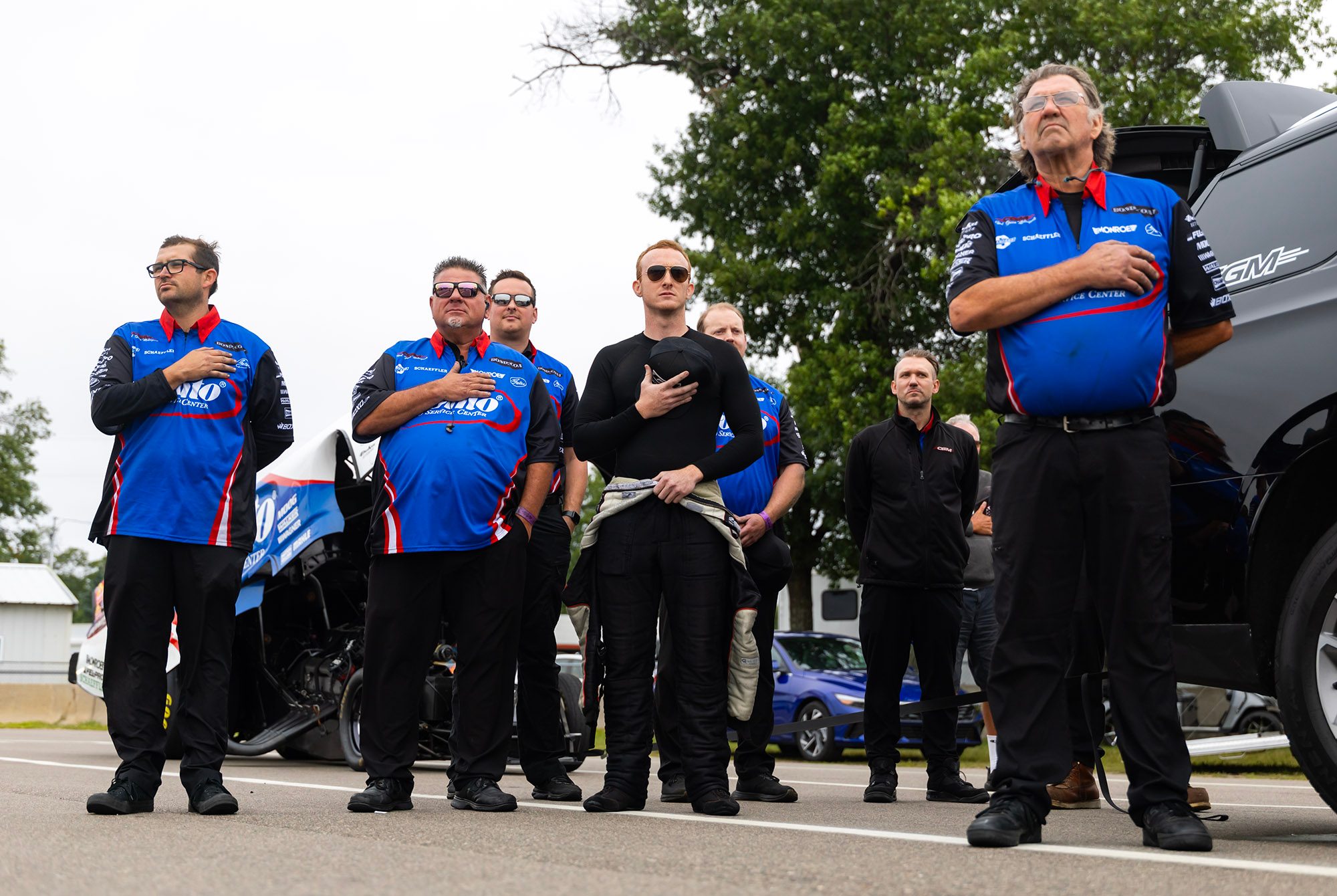 Hands on hearts for the national anthem in the lanes