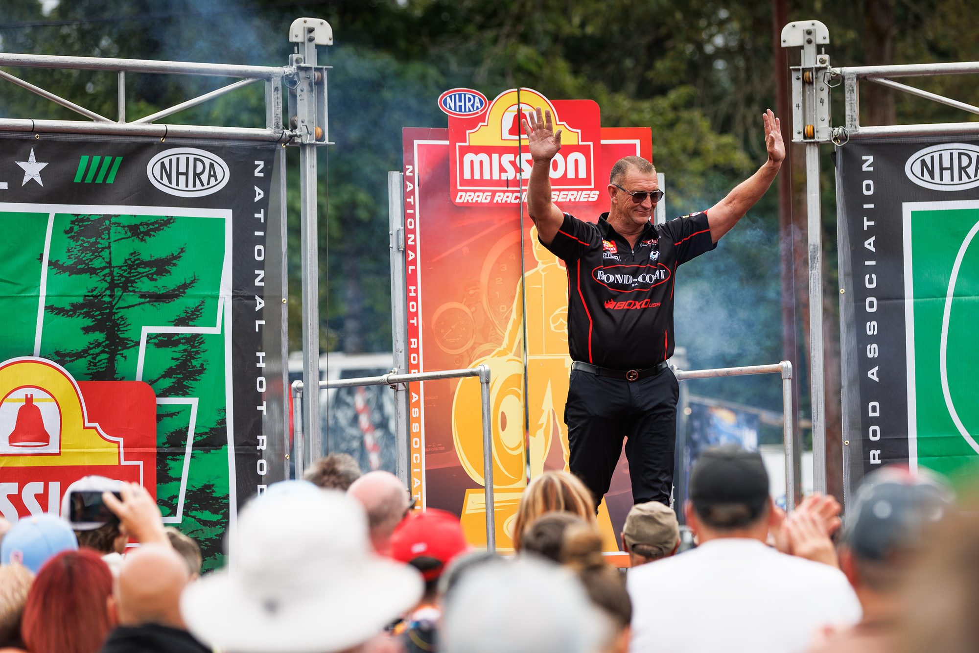 Chad Green waves from the stage during driver introductions