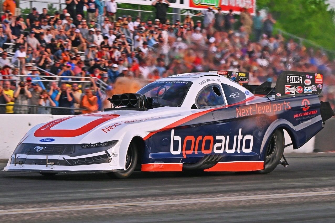 The bproauto Mustang Funny Car at speed in front of the grandstand