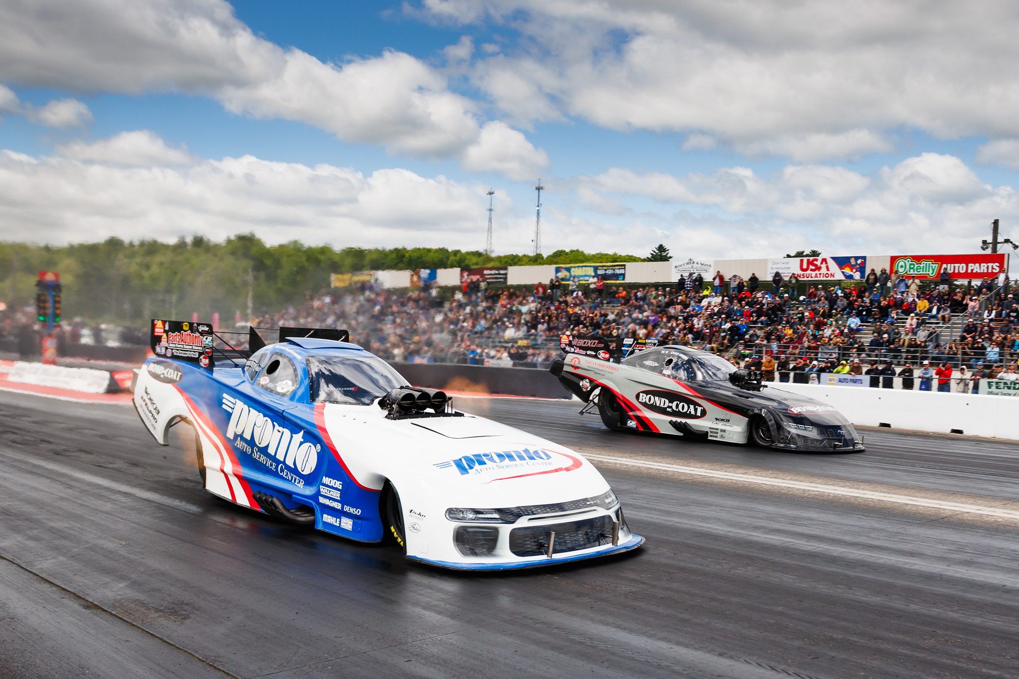The Pronto and Bond-Coat Funny Cars side by side at the line