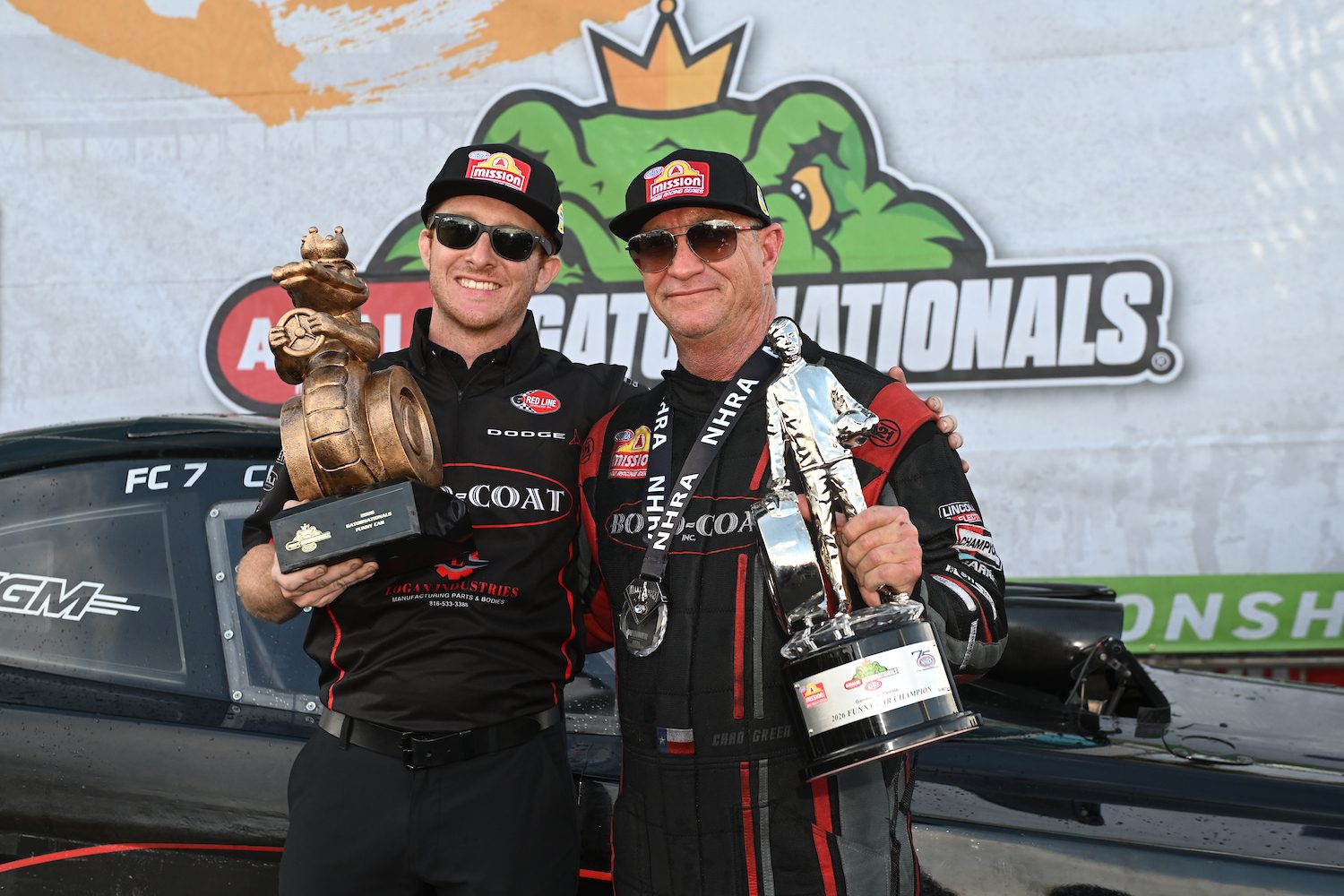 Chad and Hunter Green with trophies at the Gatornationals